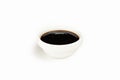 Teriyaki sauce in a bowl on a white background. For the restaurant menu. Traditional Japanese sushi seasoning. Healthy