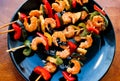 Teriyaki shrimps with zucchini and red pepper on plate