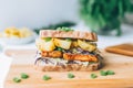 teriyaki tempeh sandwich with grilled pineapple and cabbage
