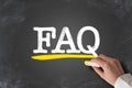 Term FAQ, frequently asked questions, written on chalkboard Royalty Free Stock Photo