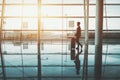 Terminal of airport with black girl waiting her flight Royalty Free Stock Photo