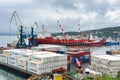 Terminal commercial sea port, crane unloaded Russian container cargo ship Sevmorput - nuclear-powered icebreaker lighter