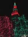 The Terminal Tower is lit up in a Christmas red and green with lights down below - Cleveland - OHIO Royalty Free Stock Photo