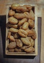 Terminalia bellerica or Terminalia chebula Organic dry harad. Dried fruits in the wooden box