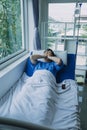 Terminally Ill Male Patient Lies on a Bad In the Hospital. Melancholy and Exhausted Patient in the Palliative Care Ward Royalty Free Stock Photo