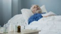 Terminally ill male sleeping in hospital after taking painkillers, medication Royalty Free Stock Photo