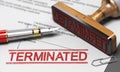 Termination of contract agreement. Word Terminated printed on a document