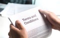 Terms and conditions text in legal agreement or document.