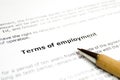 Terms of employment with wooden pen Royalty Free Stock Photo