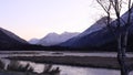 Lake and Mountains in Weak Early Morning Light