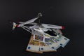Model helicopter on top of euro banknotes of different denominations