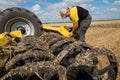 TERNOPIL REGION, UKRAINE - August 10, 2021: man inspect and configures cultivator on demonstration of agricultural machinery,