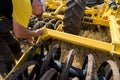 TERNOPIL REGION, UKRAINE - August 10, 2021: man inspect tractor cultivator on demonstration of agricultural machinery, exhibition