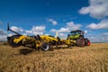 TERNOPIL REGION, UKRAINE - August 10, 2021: tractor with disc harrow Bednar Actros RO 4000R in operation at the demonstration