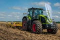 TERNOPIL REGION, UKRAINE - August 10, 2021: tractor with disc harrow, soil cultivation system in operation at the demonstration of