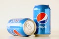 TERNOPIL, UKRAINE - MAY 28, 2022: Cold Pepsi drink cans om white background. Pepsi is a carbonated soft drink produced by PepsiCo Royalty Free Stock Photo