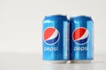 TERNOPIL, UKRAINE - MAY 28, 2022: Cold Pepsi drink cans om white background. Pepsi is a carbonated soft drink produced by PepsiCo Royalty Free Stock Photo