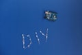 TERNOPIL, UKRAINE - May 5, 2019: DIY word from diode and arduino uno on a blue background. arduino board. DIY words for Do It