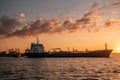 Oil and Gas tanker at sea during sunset, chemical transport vessel large oil tanker duiring sunset, transport industrial