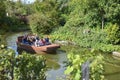 TERRA BOTANICA, ANGERS, FRANCE - SEPTEMBER 24, 2017: Tourists swim by boat in the park Terra Botanica Royalty Free Stock Photo