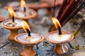 Terra-cota oil lamps as religious offerings at temple in Nepal.