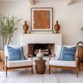 Terra cotta armchairs near white sofa with blue cushions in room with fireplace. Mid-century style home interior design