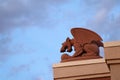 A Gargoyle Against a Darkening Sky