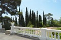 Terrace with balustrade and beautiful views of the Park with pine trees, cypress trees and columns on the background of