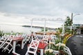 Terrace of a cafe by the sea in early morning Royalty Free Stock Photo