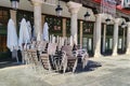 Terrace chairs and umbrellas collected and closed by the covid pandemic Royalty Free Stock Photo