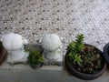 terrace decoration with sculpture dolls and bonzai cactus plant in clay pots