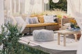Terrace design idea with rattan garden furniture set and cozy pillows and rug, real photo Royalty Free Stock Photo