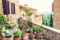 Terrace with flowers in an ancient italian house.