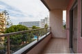 Terrace lounge with rattan armchairs and city view in a resort hotel. Royalty Free Stock Photo