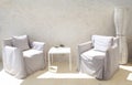 Terrace lounge with white armchairs and wall Royalty Free Stock Photo