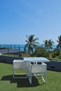 Terrace lounge with white rattan armchairs Royalty Free Stock Photo