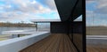 Terrace of a minimalist advanced country house. Terrace floor covering. Large mirrored windows reflect the lake landscape. 3d