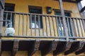 Terrace of old wooden house with yellow facade