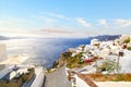 A terrace overlooks the whitewashed town of Oia, Greece and blue Aegean sea on the island of Santorini, Greece Royalty Free Stock Photo