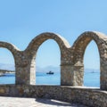 Terrace with stone arch. Scenic view of the sea, mountains and