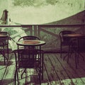 terrace tables and chairs in a small cafe