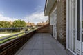 Terrace on the top floor of a single-family home with views of a community plot in an urbanization of single-family homes with a Royalty Free Stock Photo