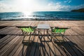 Terrace view of sea waves and coast landscape seascape with bench chair beach on wooden bridge balcony Tropical island with ocean Royalty Free Stock Photo