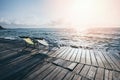 Terrace view of sea waves and coast landscape seascape rock with bench chair beach on wooden bridge balcony Tropical island with Royalty Free Stock Photo