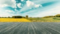 Terrace with a wonderful view. Panorana with yellow field and imposing blue sky. Living in nature Royalty Free Stock Photo