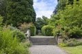 Terraced garden with stone steps, balustrade and planters. Royalty Free Stock Photo