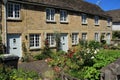 Terraced houses and gardens in the village Cirencester in England. Royalty Free Stock Photo