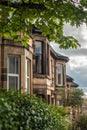 Terraced Houses in a Treelined Residential Street In Glasgow Scotland Royalty Free Stock Photo