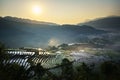 Terraced rice field in water season, the time before starting grow rice, with clouds on background in Y Ty, Lao Cai province, Viet