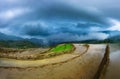 Terraced rice field in water season, the time before starting grow rice, with black clouds coming on background in Y Ty, Lao Cai p Royalty Free Stock Photo